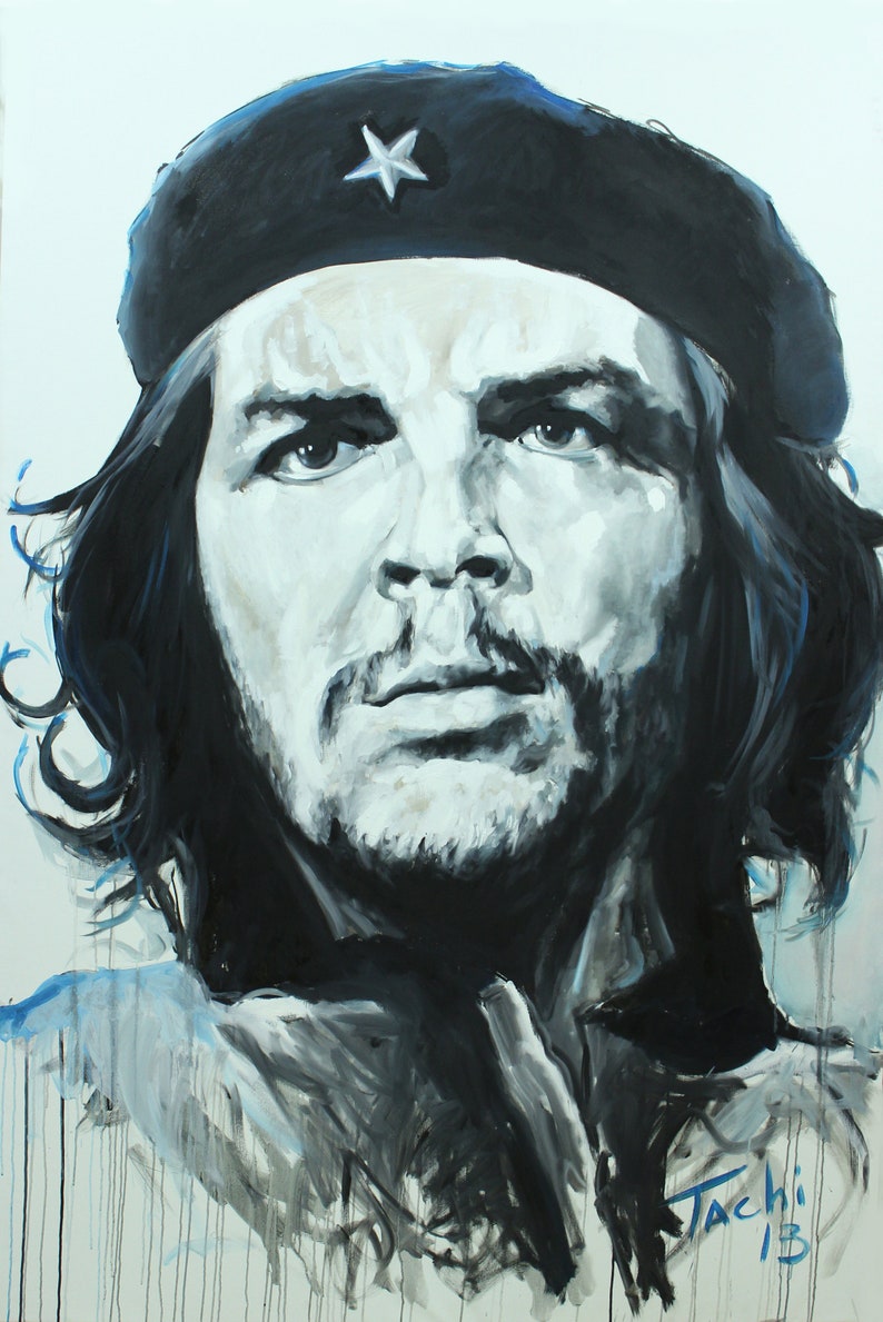 May include: A black and white portrait painting of a man wearing a black beret with a white star. The artwork features a detailed depiction of the man's face, with dark hair and a beard. The painting is signed "Tachi '13".