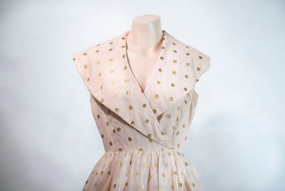 1950s pastel pink party dress with gold polka dots