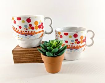 Vtg. Stacking Mugs. White Ceramic with Colorful Geometric Flowers & Circles. Set of 2 Retro Coffee Cups. 1970's Kitchen. Made in Japan.