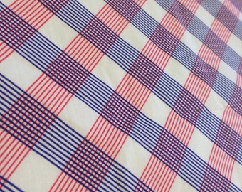 May include: White fabric with a red and blue checkered pattern. The fabric has a diagonal pattern with thin red and blue lines.