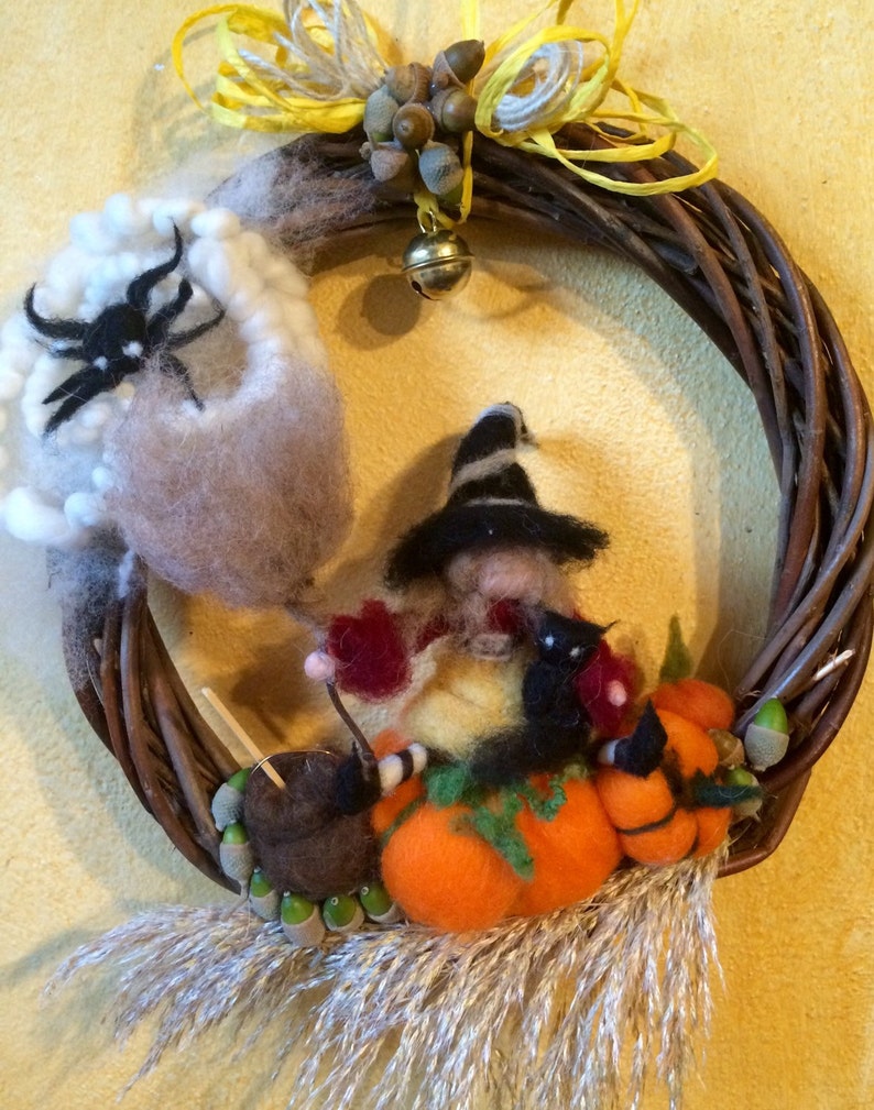 with Witch Halloween natural elements and a bell black cat spider in carded fairy wool Wreath Garland to hang on the door Waldorf