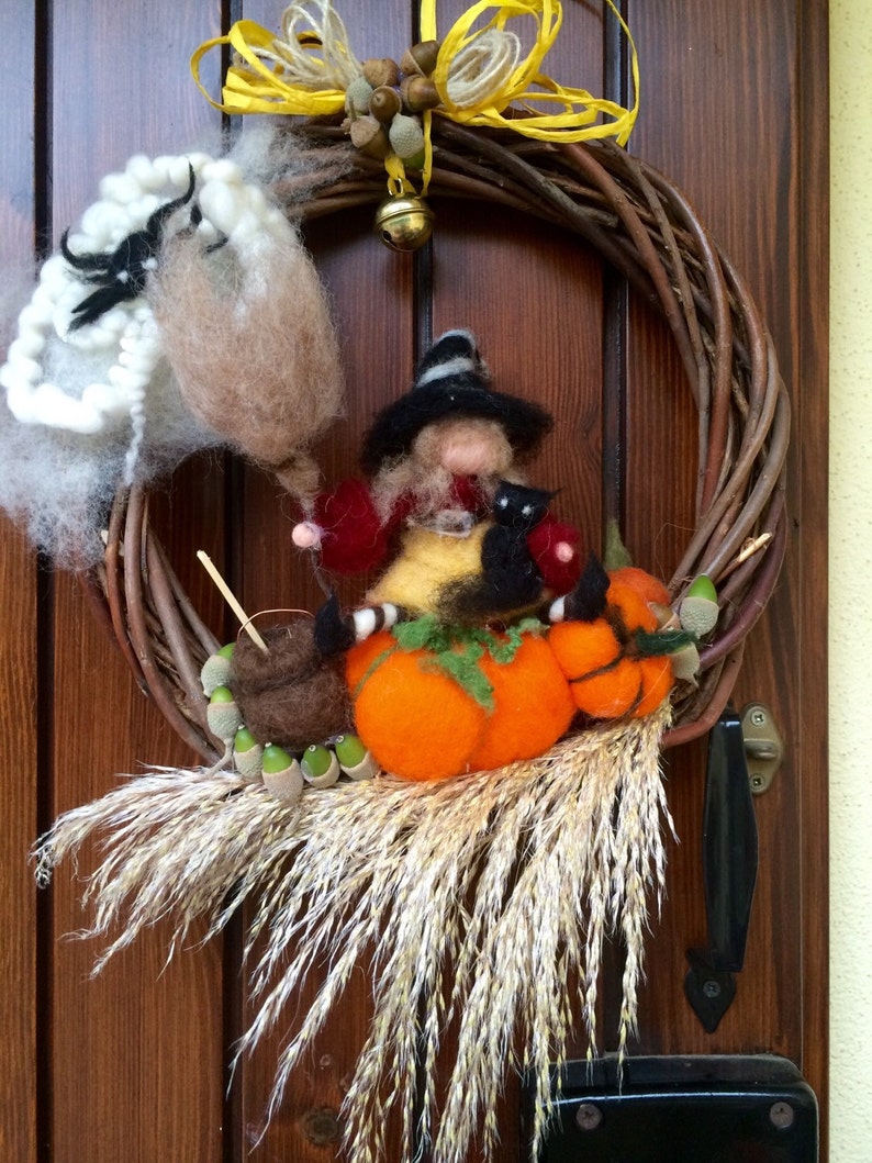 with Witch Halloween natural elements and a bell black cat spider in carded fairy wool Wreath Garland to hang on the door Waldorf
