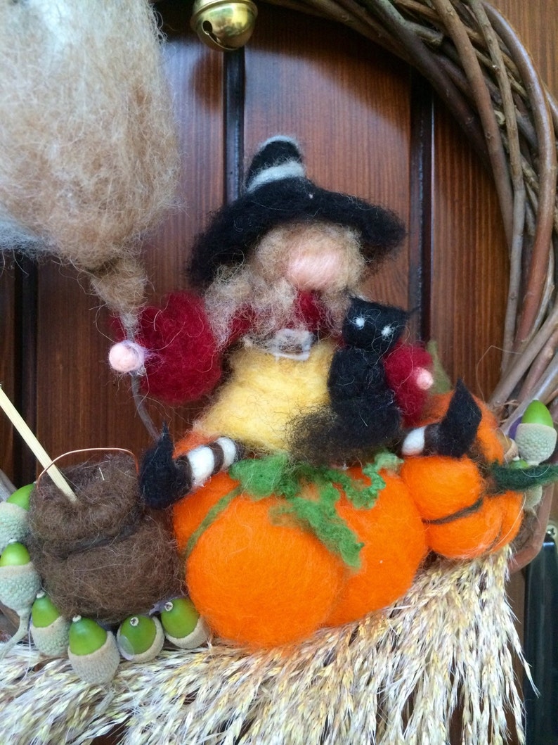 with Witch Halloween natural elements and a bell black cat spider in carded fairy wool Wreath Garland to hang on the door Waldorf