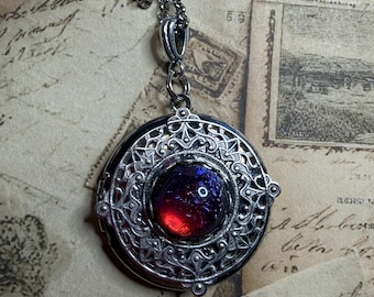 Photo locket, Mexican opal also called dragons breath cabochon center. 24 inch rolo chain.