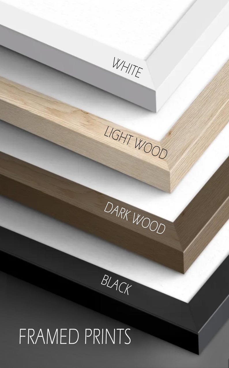 May include: Close-up of framed prints with four different frame colors: white, light wood, dark wood, and black. The text on the image reads "WHITE", "LIGHT WOOD", "DARK WOOD", "BLACK", and "FRAMED PRINTS".