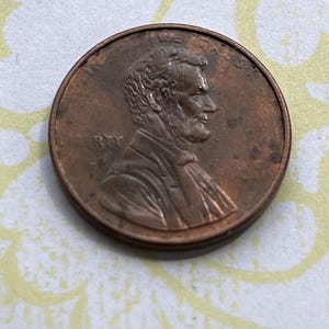 Rare Mint ERROR COIN 1 Cent Lincoln Penny No Date, No Mint Mark, Lettering Faded Struck Through Grease, Highly Collectible US Minted Money