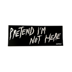 May include: A black rectangular sticker with the words "PRETEND I'M NOT HERE" in white, stylized, jagged lettering. The word "DRIPFACE" is printed in white in the bottom right corner.