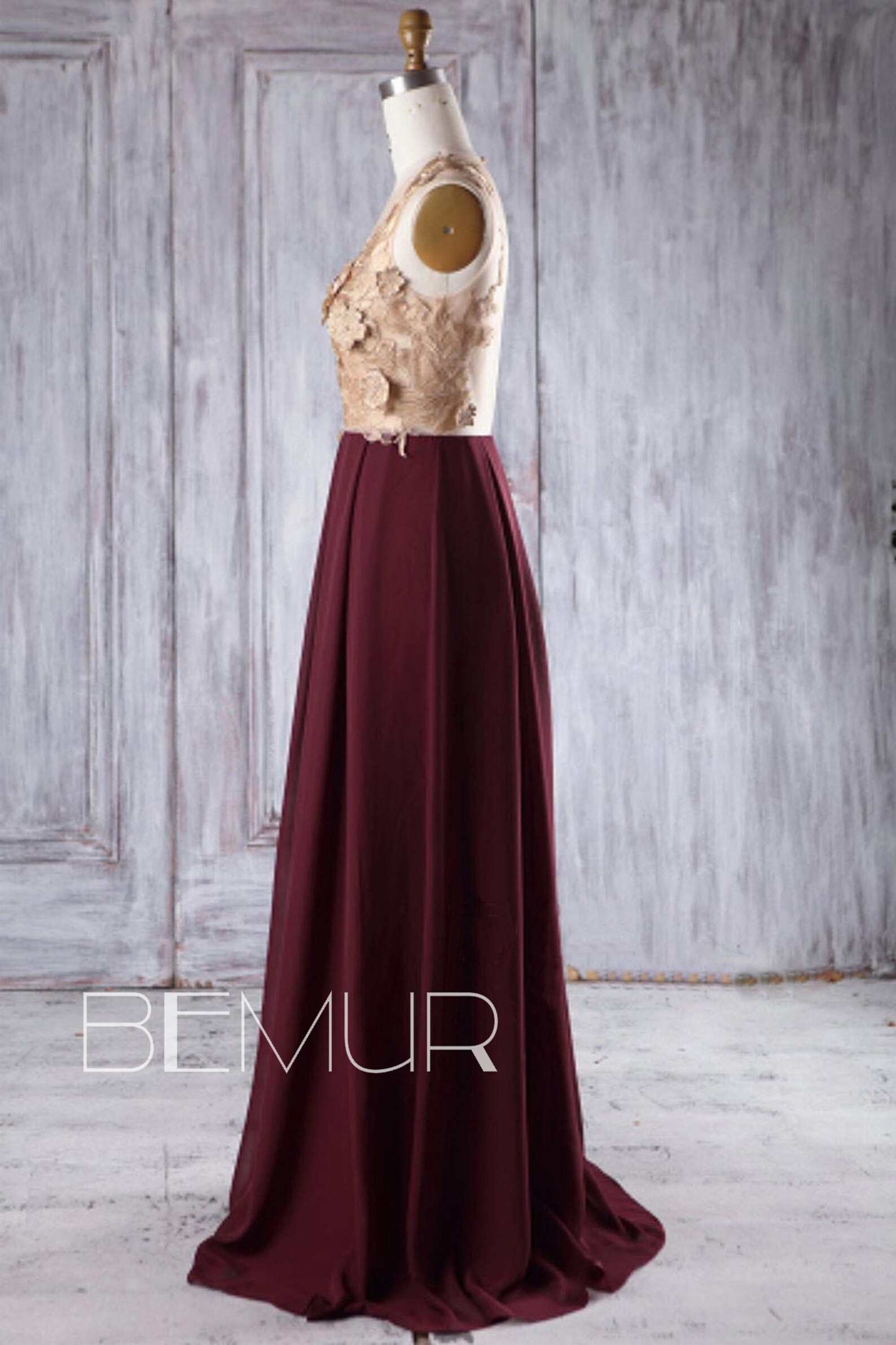maroon and golden colour gown