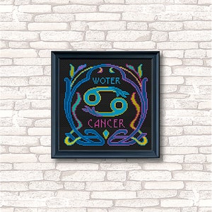May include: A black framed cross-stitch design featuring the Cancer zodiac sign in blue and yellow with the words "WATER" and "CANCER" in a colorful font.