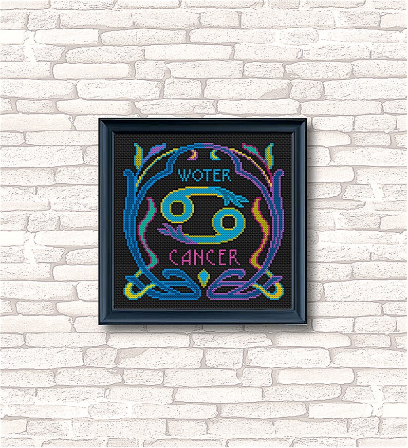 May include: A black framed cross-stitch design featuring the Cancer zodiac sign in blue and yellow with the words "WATER" and "CANCER" in a colorful font.
