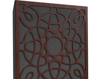 May include: A square, wooden wall panel with a dark brown frame and a decorative, abstract pattern cut into the front. The pattern is a series of interconnected, curved lines and shapes, set against a dark gray background.