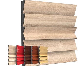 May include: A display of wooden shutter samples in various colors. The main section features light wood-grain panels, while the lower section showcases smaller samples in shades of red, brown, and lighter wood tones. The samples are arranged to show the different color options.