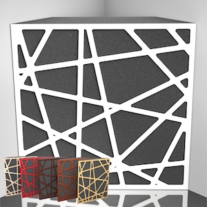 May include: A large, dark gray cube with a white geometric pattern. Four smaller cubes in red, brown, and gold with similar designs are in front. The design features intersecting lines, creating an abstract, modern look.