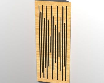 May include: A wooden corner acoustic panel with a black top. The panel has a light wood grain finish and vertical black grooves. The panel is designed to fit into a corner.