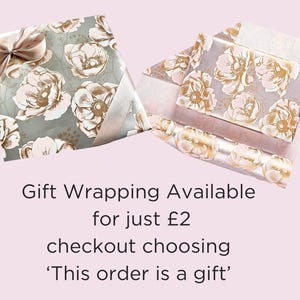 May include: Two gift wrapping options with floral patterns. One is a light gray with gold floral accents, the other is a light pink with gold floral accents. The text reads: "Gift Wrapping Available for just &pound;2 checkout choosing 'This order is a gift'"