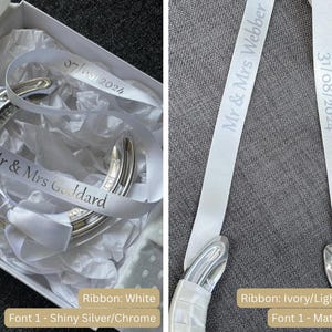 May include: Two white satin ribbons with silver lettering. One ribbon says "Mr & Mrs Goddard" with the date "07/06/2024". The other ribbon says "Mr & Mrs Webber" with the date "31/08/2024".