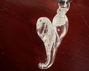 Memorial cremation ashes medallion. made by swirling small amounts of loved one’s ashes with borosilicate glass.  Beautiful and meaningful