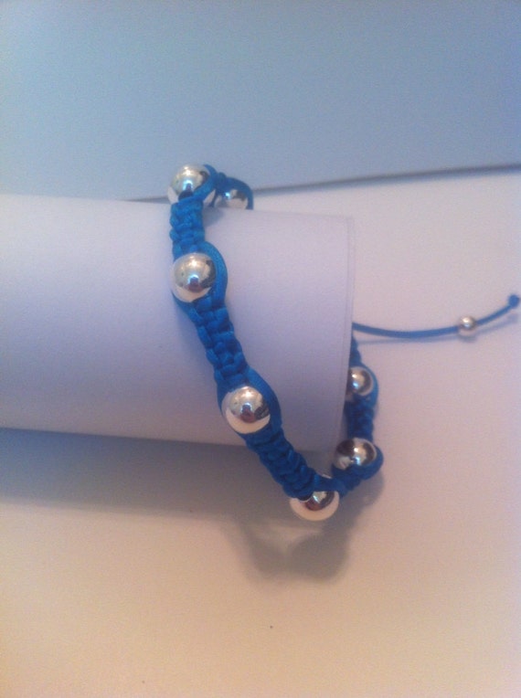 Items similar to Bright blue satin cord with 7 silver beads on Etsy