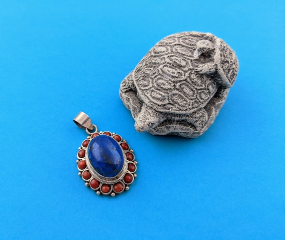 Tibetan Buddhist Gau Pendant in Red Coralwith Ganesh or Buddha Tibetan Buddhist Gau Pendant in Red Coralwith Ganesh or Buddha