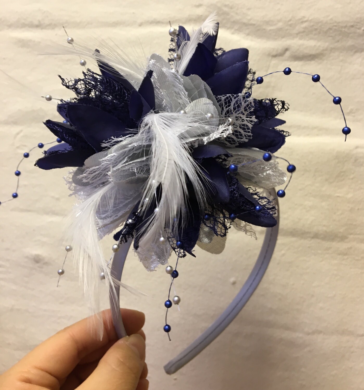 Caprilite Silver and Navy Fascinator 