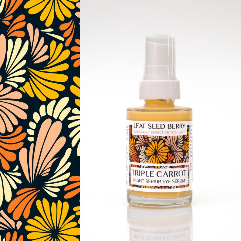May include: A clear glass bottle of Triple Carrot Night Repair Eye Serum with a white pump top. The label features floral designs and the text "Leaf Seed Berry". The background includes a dark blue floral pattern with yellow, orange, and peach colors.