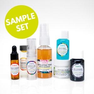 May include: A sample set of skincare products in small bottles and jars. The products include a blue tansy milk jelly cleanser, a ginger turmeric infused jojoba oil, a perfect ten protect and perfect serum, an exfoliating toner rose essence, a mermaid cream hyaluronic marine moisturizer, and a gel cleanser charcoal and tea tree.