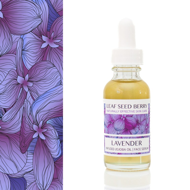 May include: A glass bottle of lavender infused jojoba oil face serum. The bottle is clear and has a gold label with the text "Leaf Seed Berry Naturally Effective Skin Care Lavender Infused Jojoba Oil | Face Serum".