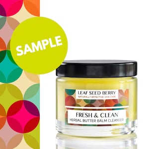 May include: A yellow jar with a black lid containing a yellow balm. The jar has a label with the text "LEAF SEED BERRY NATURALLY EFFECTIVE SKIN CARE FRESH & CLEAN HERBAL BUTTER BALM CLEANSER".