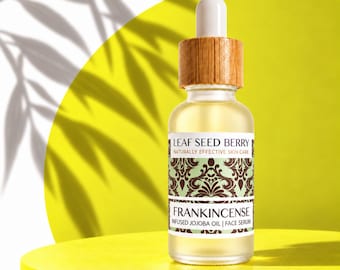May include: A clear glass dropper bottle with a wooden cap containing face serum. The label reads LEAF SEED BERRY NATURALLY EFFECTIVE SKIN CARE FRANKINCENSE INFUSED JOJOBA OIL | FACE SERUM with a green and brown damask pattern.