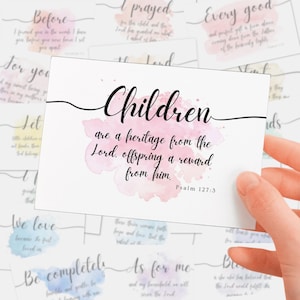 Puede incluir: Una tarjeta blanca con la palabra "Children" en escritura negra, sobre una salpicadura de acuarela rosa. La tarjeta incluye el texto "are a heritage from the Lord, offspring a reward from him." Otras tarjetas con texto están en el fondo.