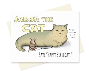 May include: A greeting card featuring a cartoon cat with a large, round body and a small mouse on a leash. The cat is labelled "Jabba the Cat" and the text "Ban gon wan she co cah Solo." is written in a handwritten style. The card says "Says "Happy Birthday.""