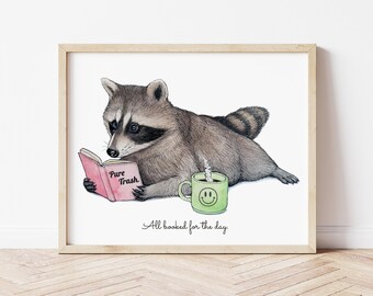 Lámina artística de un mapache leyendo una novela romántica. Ilustración de novela erótica para lectores de contenido erótico.