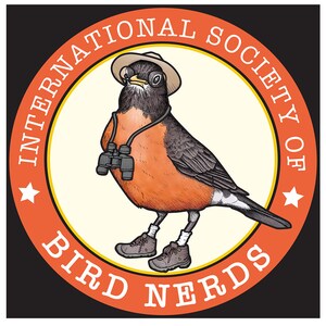 May include: A circular badge with a cartoon robin wearing a hat, binoculars, and hiking boots. The text reads "INTERNATIONAL SOCIETY OF BIRD NERDS" around the border. The robin has orange and black feathers. The badge is orange and cream-colored.