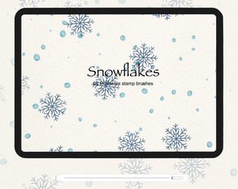 May include: A digital tablet screen displaying a white background with blue snowflakes and blue dots. The text "Snowflakes" and "60 Procreate stamp brushes" is displayed on the screen. A white stylus is lying on a white surface below the tablet.