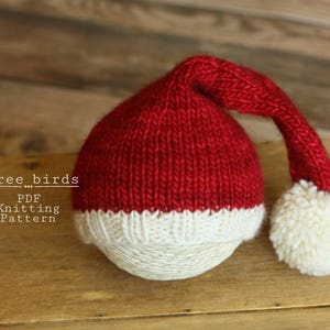 May include: Red and white knitted Santa hat with a white pom-pom. PDF Knitting Pattern. three_birds...