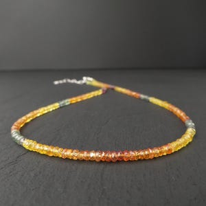 colorful faceted sapphire gemstone necklace in orange, yellow, blue, red with sterling silver clasp
