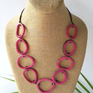 Deep pink tagua nut. A light and bold natural tagua necklace. Tagua beads in a simple statement necklace. Pink tagua necklace.