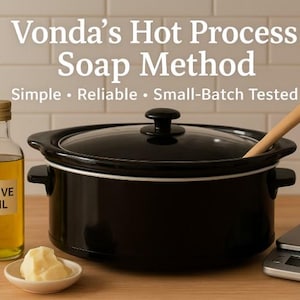 May include: A black slow cooker with a wooden spoon, a bottle of olive oil, a small dish of shea butter, and a digital scale. The text "Vonda's Hot Process Soap Method" is at the top.