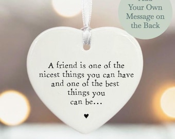 May include: White ceramic heart-shaped ornament with the text "A friend is one of the nicest things you can have and one of the best things you can be..."