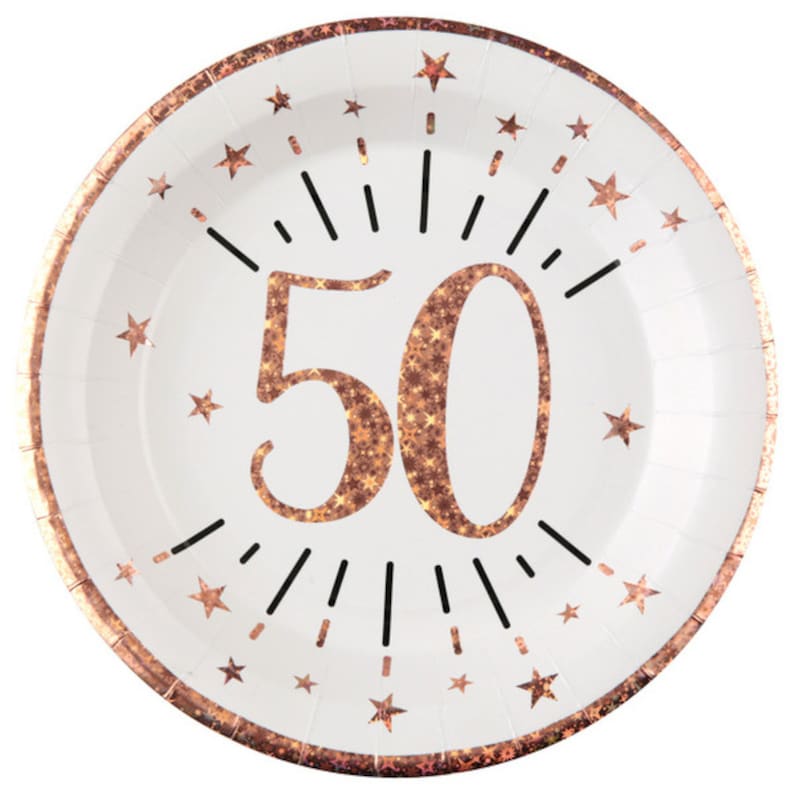 May include: White paper party plates with a rose gold glitter design. The plates feature the number 50 with a starburst design and small stars around the edge.
