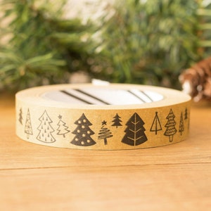 May include: A roll of brown paper tape with a repeating pattern of black Christmas trees. The trees are in various styles, including a tree with polka dots, a tree with a star, and a tree with a simple outline.