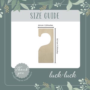 May include: A size guide for a wooden door hanger with a hook. The hanger is 5.78 inches tall and 2.59 inches wide. The text "Thank you for supporting our small business" and "luck & luck" are also visible.
