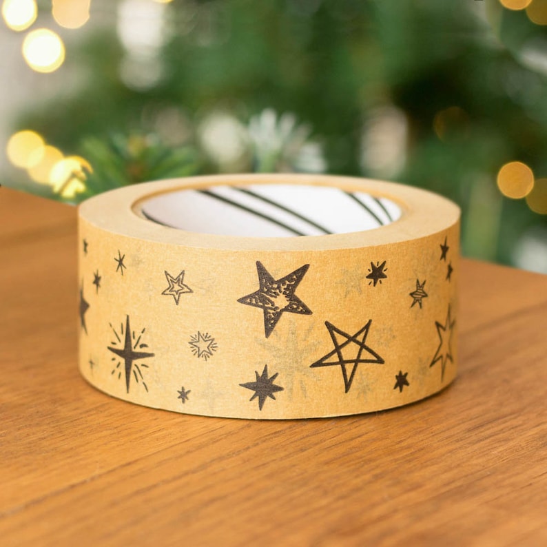 May include: A roll of brown packing tape with a repeating pattern of black stars.