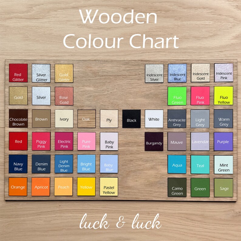 May include: Wooden color chart with a variety of colors, including red, blue, green, yellow, pink, and black. The chart is labeled "Wooden Color Chart" and "luck & luck".