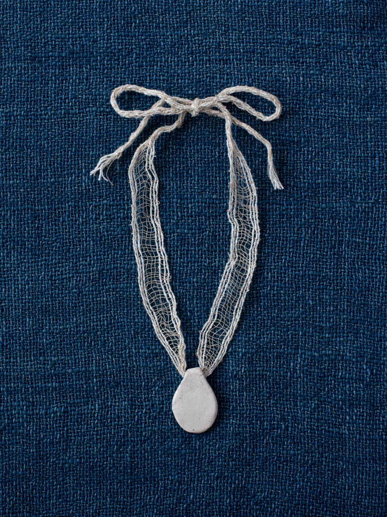White and Beige Handwoven Pendant Collar