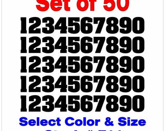May include: A set of 50 black numbers, 1 through 0, in a bold font. The numbers are arranged in five rows of ten numbers each. The text "Set of 50" is in red at the top of the image. The text "Select Colour & Size" and "Stock # F11" is in blue at the bottom of the image.