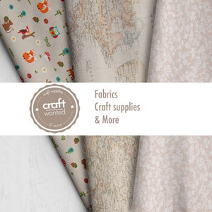 May include: A close-up of three different fabric swatches. The first fabric has a woodland pattern with foxes, owls, mushrooms, and flowers. The second fabric is a vintage world map. The third fabric has a delicate floral pattern. The text "craft wanted" is visible in a circle with a star on each side. The text "Fabrics, Craft supplies & More" is also visible.