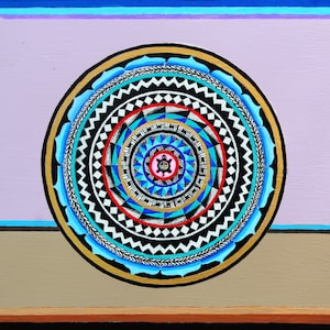 May include: A colorful mandala with a black, white, red, blue, and gold color scheme. The center of the mandala features a stylized turtle with a pink shell and a blue body.