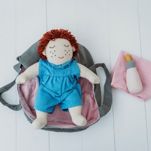 Fair trade cotton baby doll and carry cot, bottle play set, light skin tone. Skye
