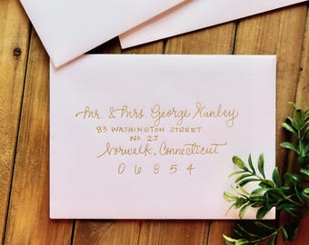 modern calligraphy for wedding invitations . hand written gold script . wedding envelopes & invites